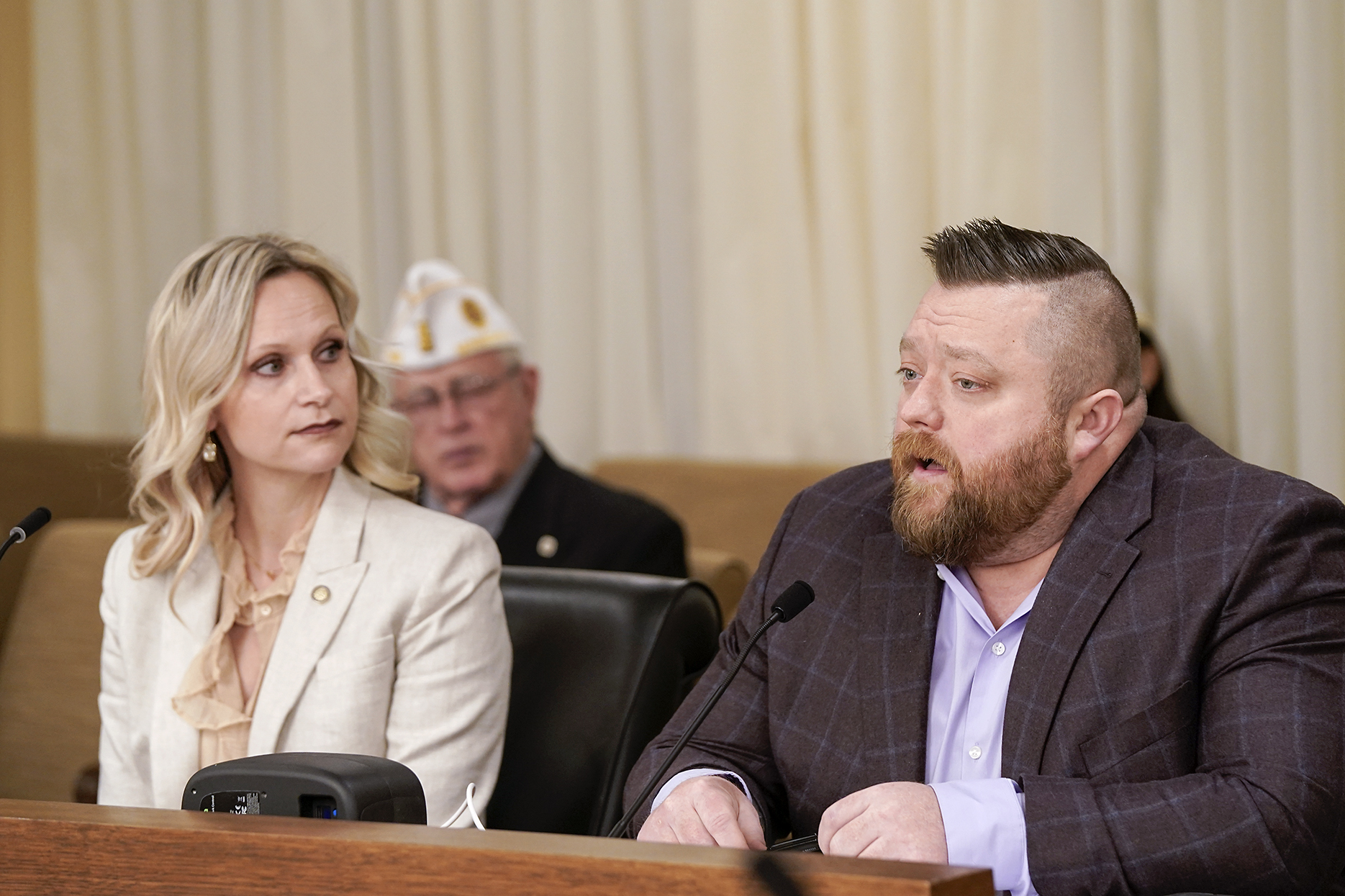 Trent Dilks, legislative director of Disabled American Veterans Department of Minnesota, testifies Feb. 12 before the House Veterans and Military Affairs Division in support of HF194, sponsored by Rep. Krista Knudsen. (Photo by Michele Jokinen)