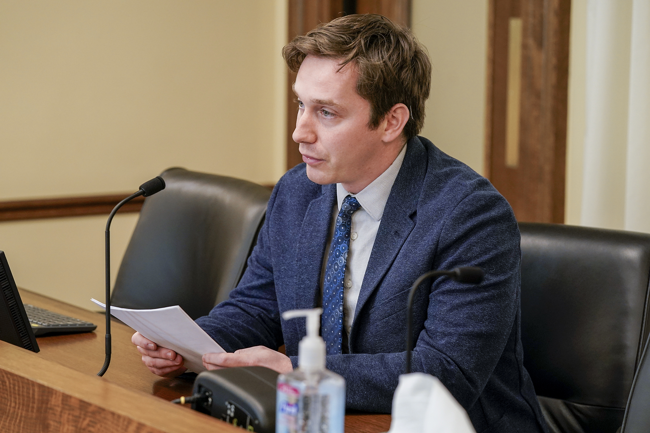 Nick Haeg, senior associate of electric vehicles for Fresh Energy, testifies before the House Transportation Finance and Policy Committee against HF189 that would modify surcharges and highway funding related to electric vehicles. (Photo by Michele Jokinen)