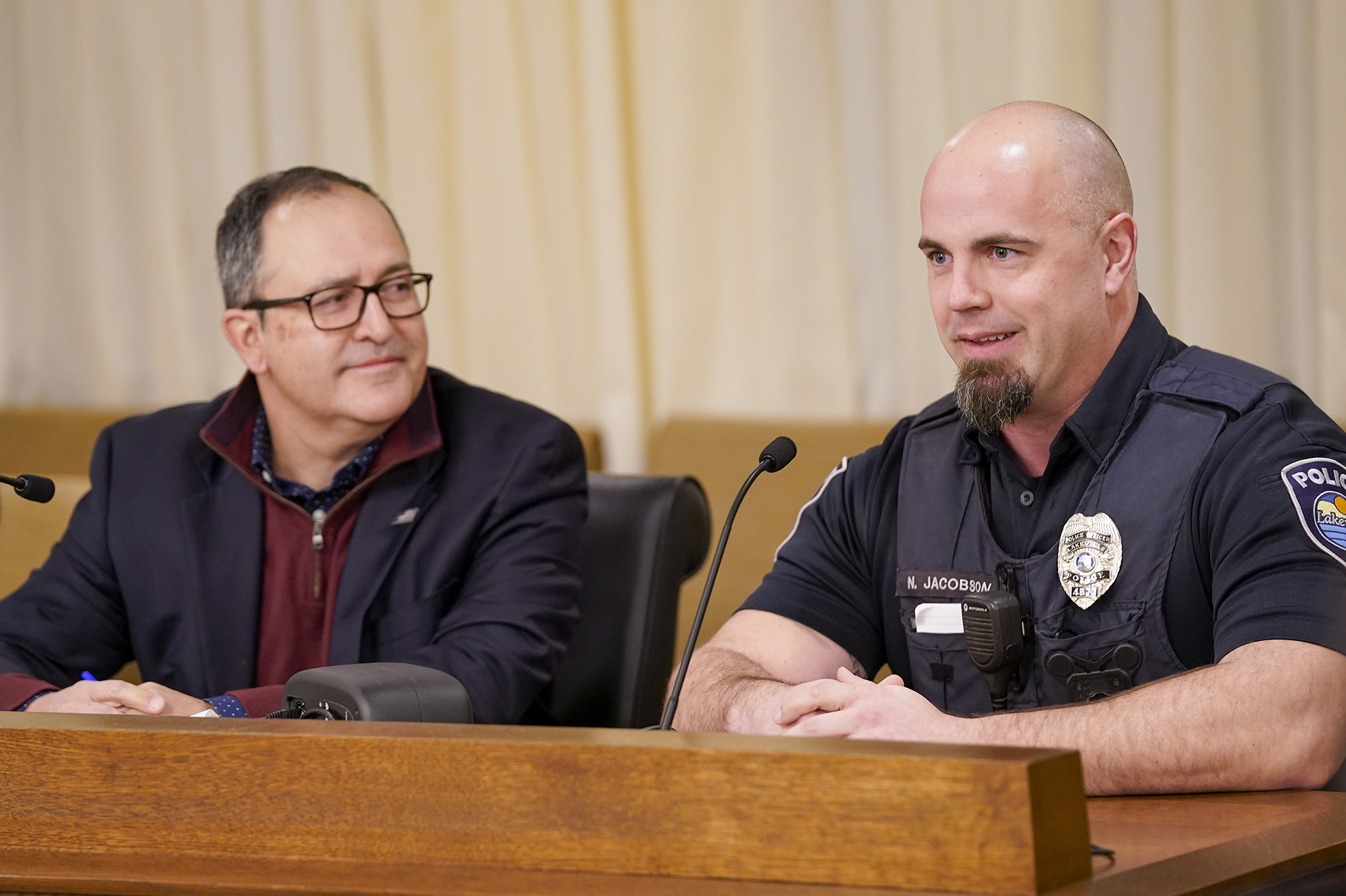 Lakeville Police Officer and veteran Nick Jacobson testifies Feb. 19 before the House workforce committee about his positive experience with equine experimental mental health therapy. Rep. Jon Koznick, left, sponsors HF261 to provide $500,000 for the therapy to further aid first responders suffering from job-related trauma and PTSD. (Photo by Michele Jokinen)  