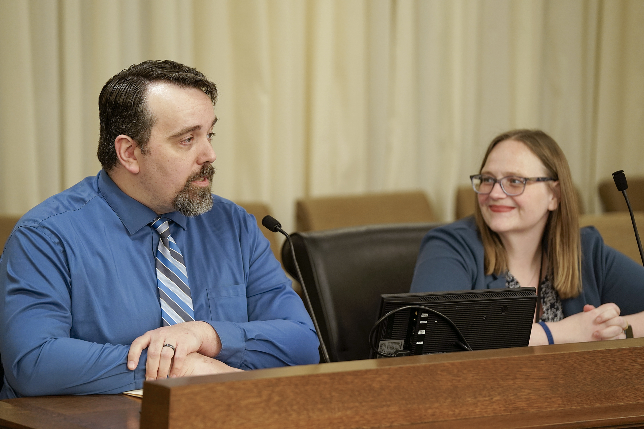 Kyle Mullen, adult services director of Workforce Development, Inc., testifies before the House Workforce, Labor, and Economic Development Finance and Policy Committee Feb. 25 in support of HF661. Sponsored by Rep. Kim Hicks, right, the bill would provide funding for the Bridges to Healthcare program. (Photo by Michele Jokinen)