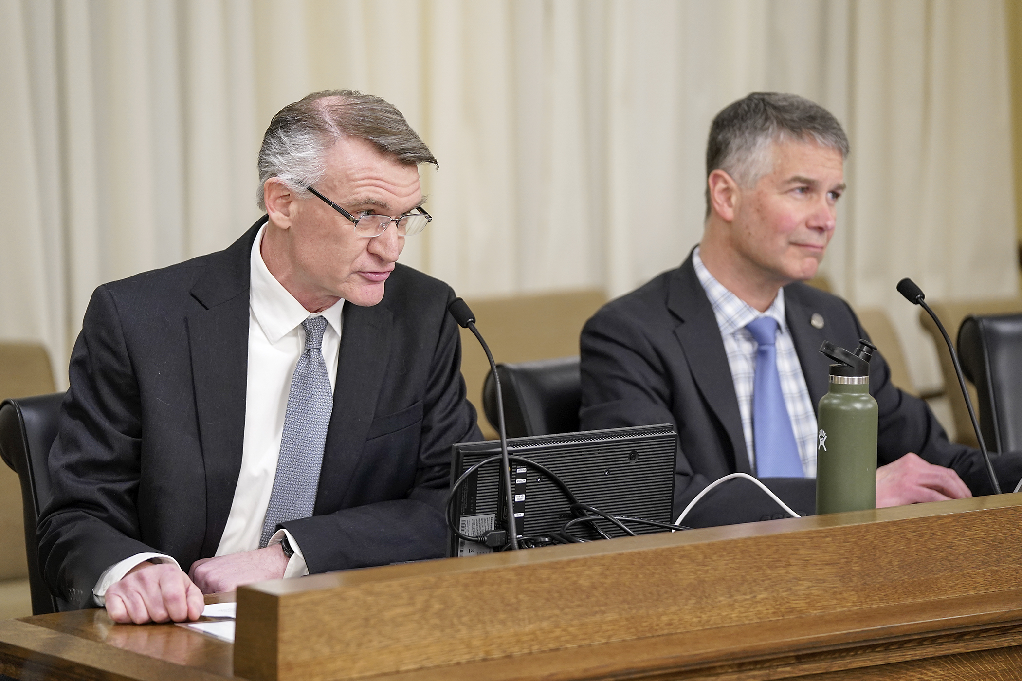 Hugo City Administrator Bryan Bear testifies before the housing committee March 12 regarding HF2140. Sponsored by Rep. Larry Kraft, right, the bill would require certain municipalities to create mixed housing districts and commercial corridor districts. (Photo by Michele Jokinen)