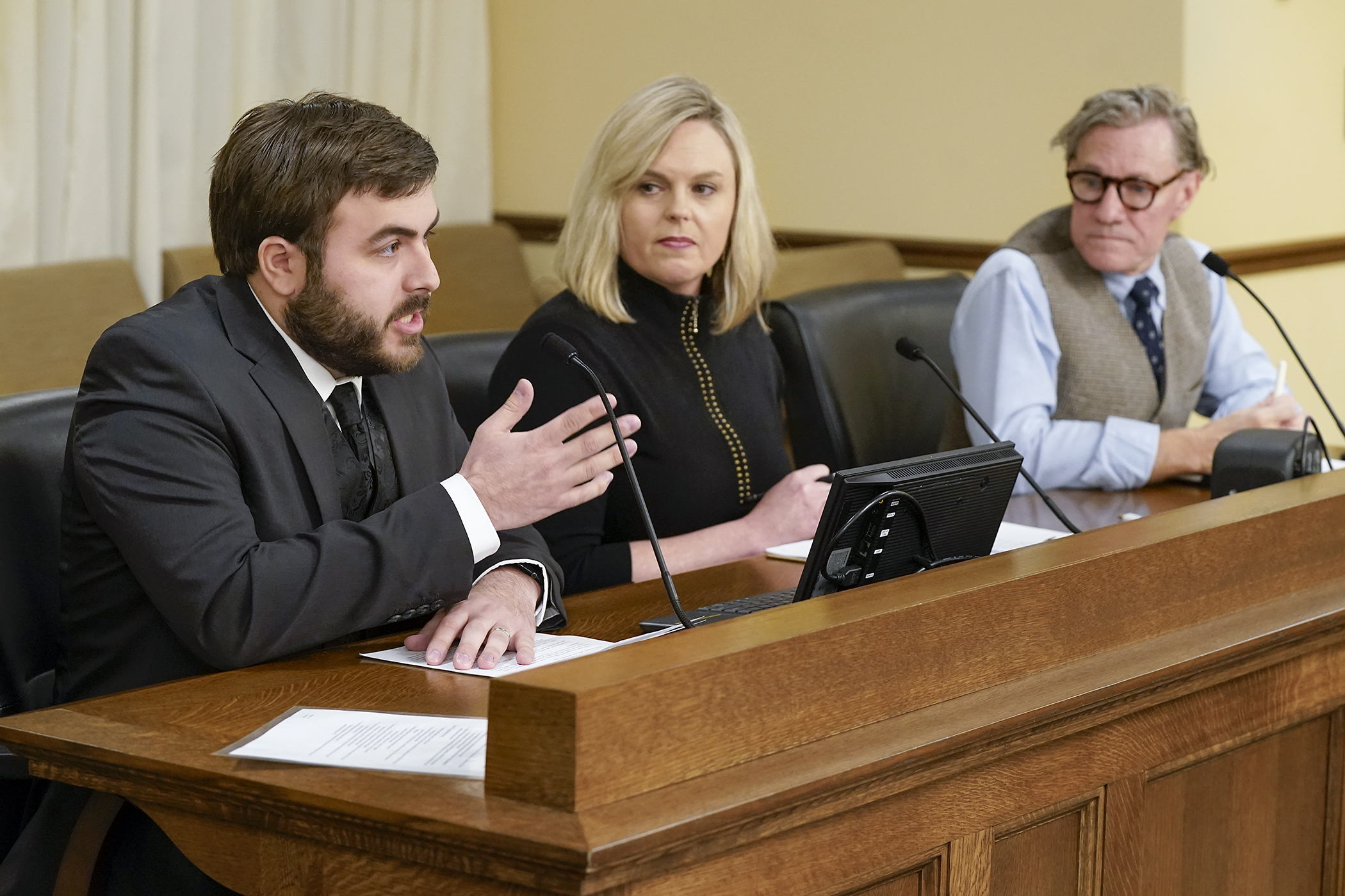 Jackson Groskreutz with the Sherburne Wright Cable Commission and Shannon Slatton Schwartz, executive director of CCX Media, offer support for a community cable TV funding bill sponsored by Rep. Danny Nadeau. (Photo by Michele Jokinen)